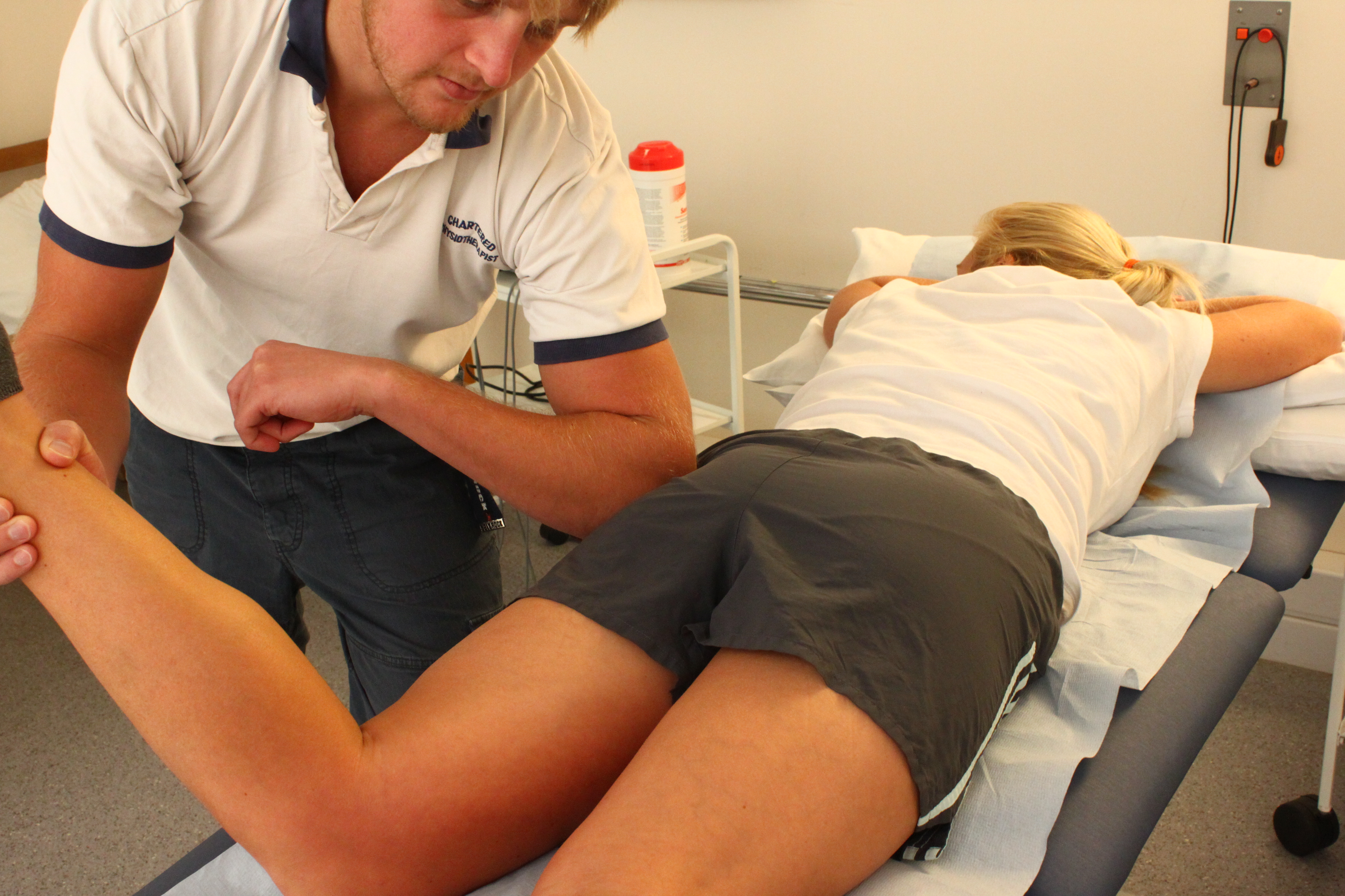 © Lewes Physiotherapy Clinic. Physiotherapist using a therapy